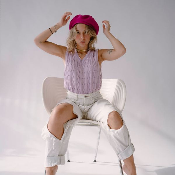 Person feeling energetic after a yoga session in a modern studio.